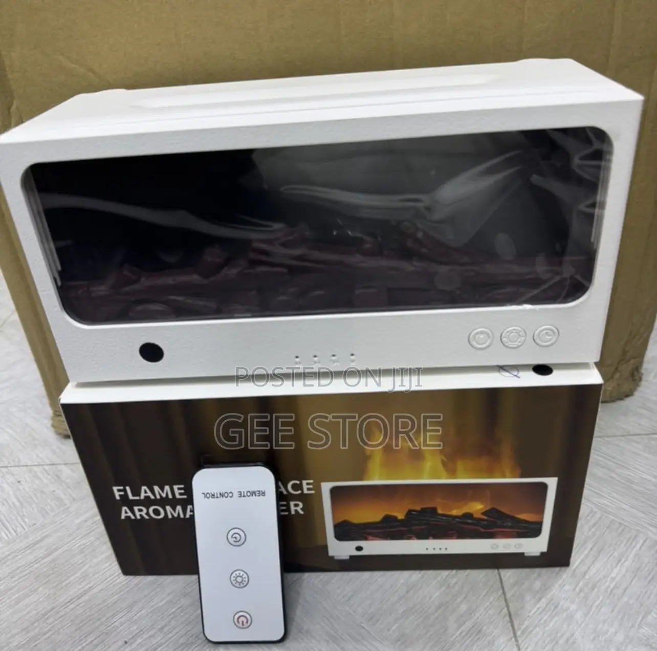 White Flame Fireplace Aroma Diffuser With Its Box and Remote Control