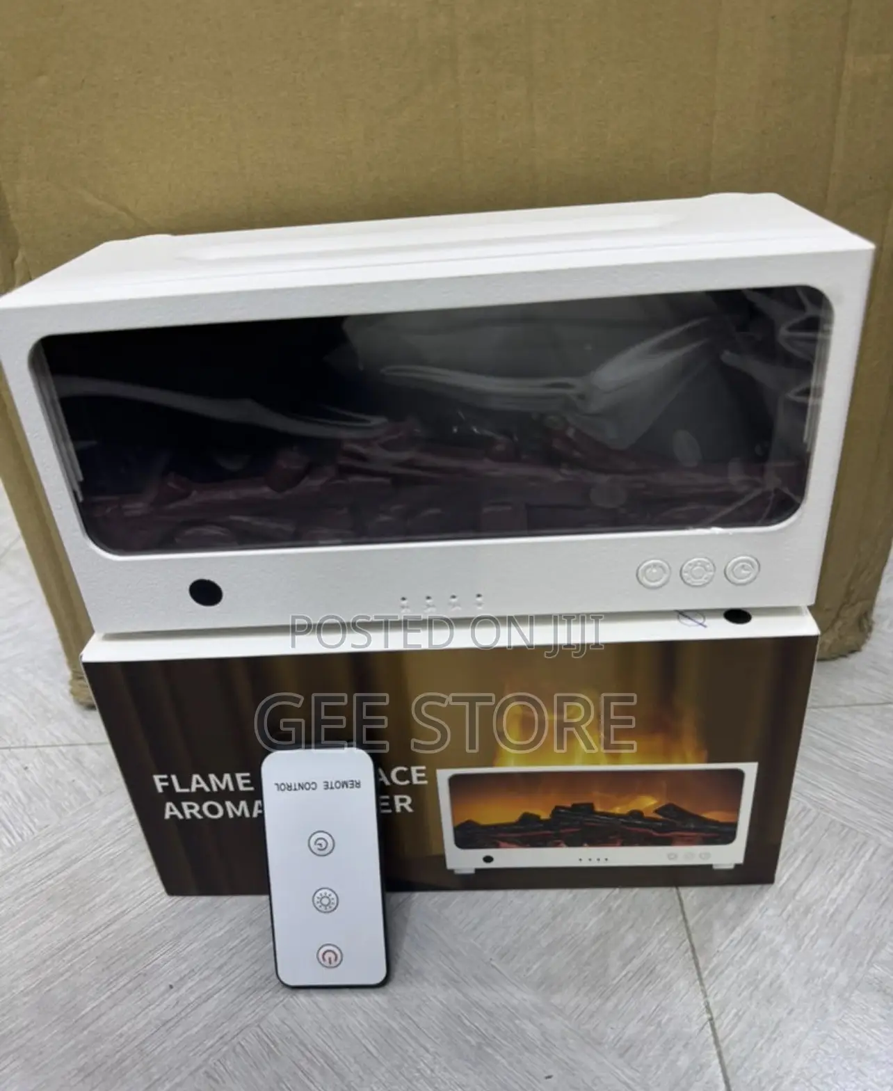 White Flame Fireplace Aroma Diffuser With Its Box and Remote Control