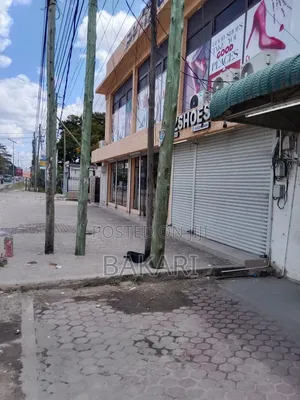 NYUMBA INAUZWA YENYE MADUKA 12 for Sale in Kinondoni Road