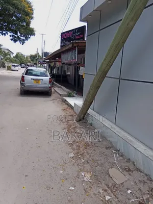 NYUMBA INAUZWA YENYE MADUKA 12 for Sale in Kinondoni Road