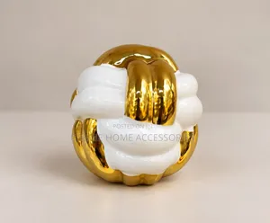 Ceramic Knot Decorative Sculpture in White With Gold Sections.