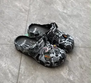 A Bathing Ape X Crocs Classic Clogs Feature Camouflage Print |Shop Now