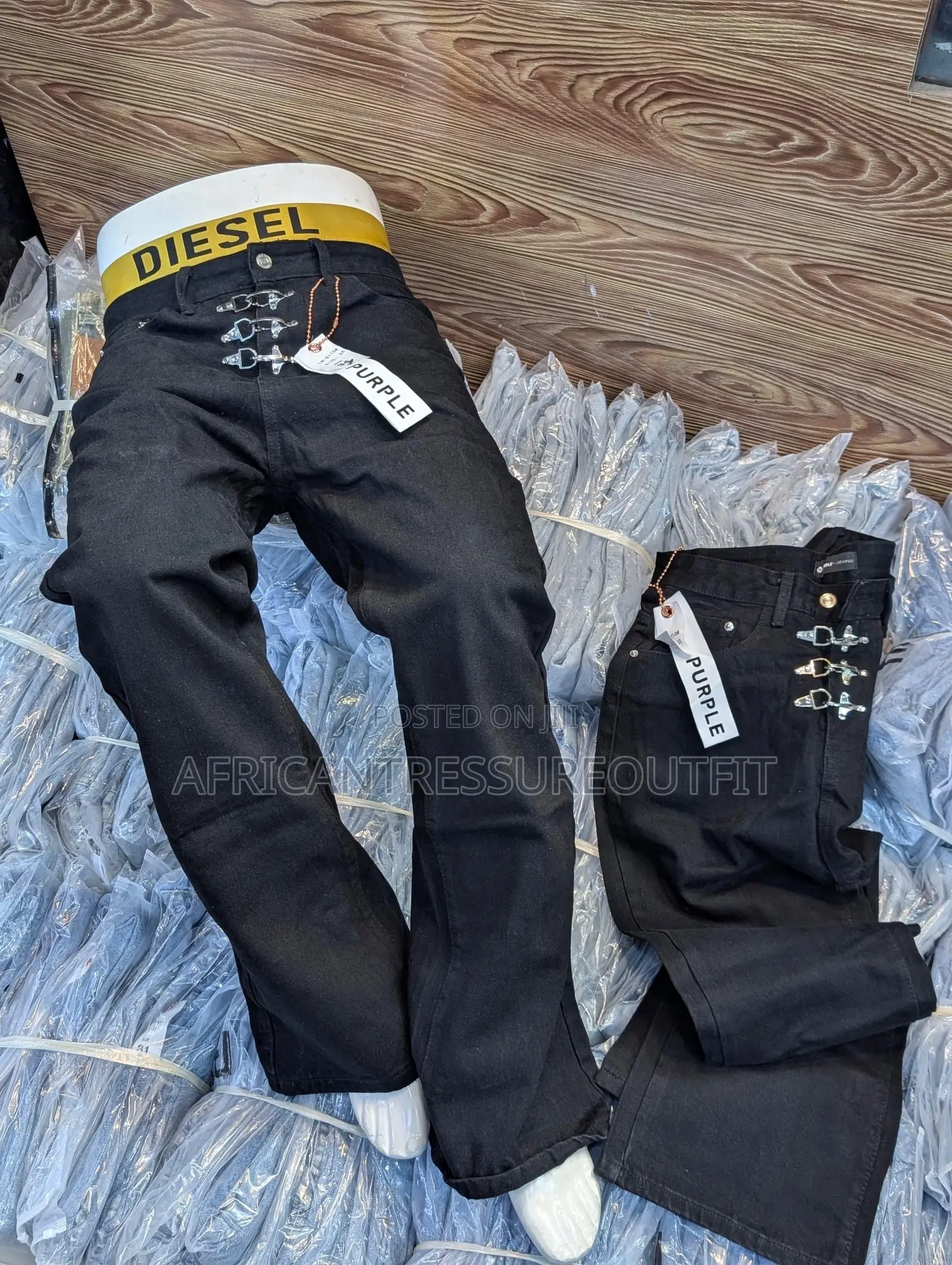 Blue and Black Demin Jeans Featuring Distinctive Hook and Eye Closure