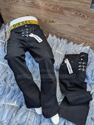 Blue and Black Demin Jeans Featuring Distinctive Hook and Eye Closure