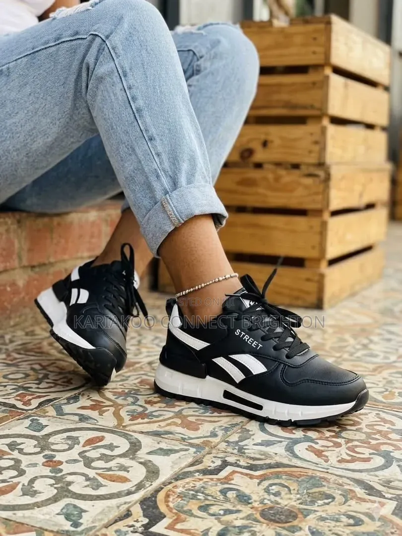 White & Red Accent Sneakers With Street Branding