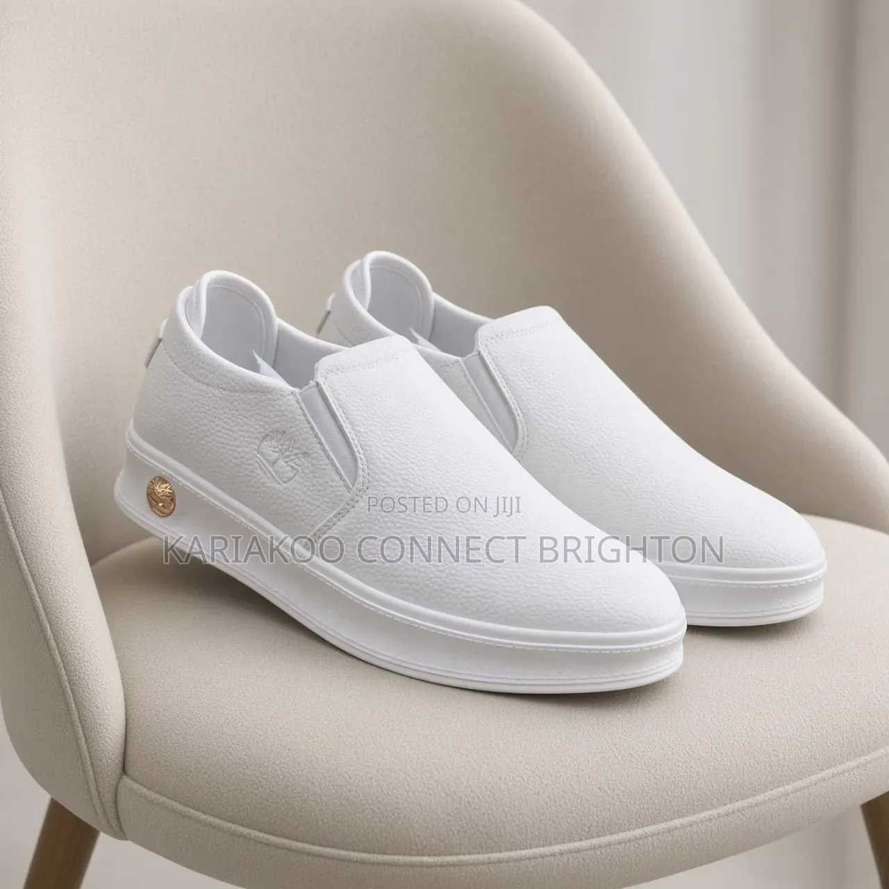White Pebbled Leather Slip-on Casual Sneakers With Embossed Logo