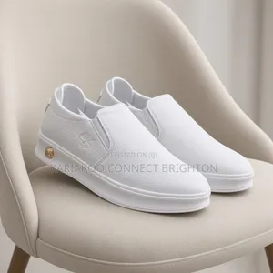 White Pebbled Leather Slip-on Casual Sneakers With Embossed Logo