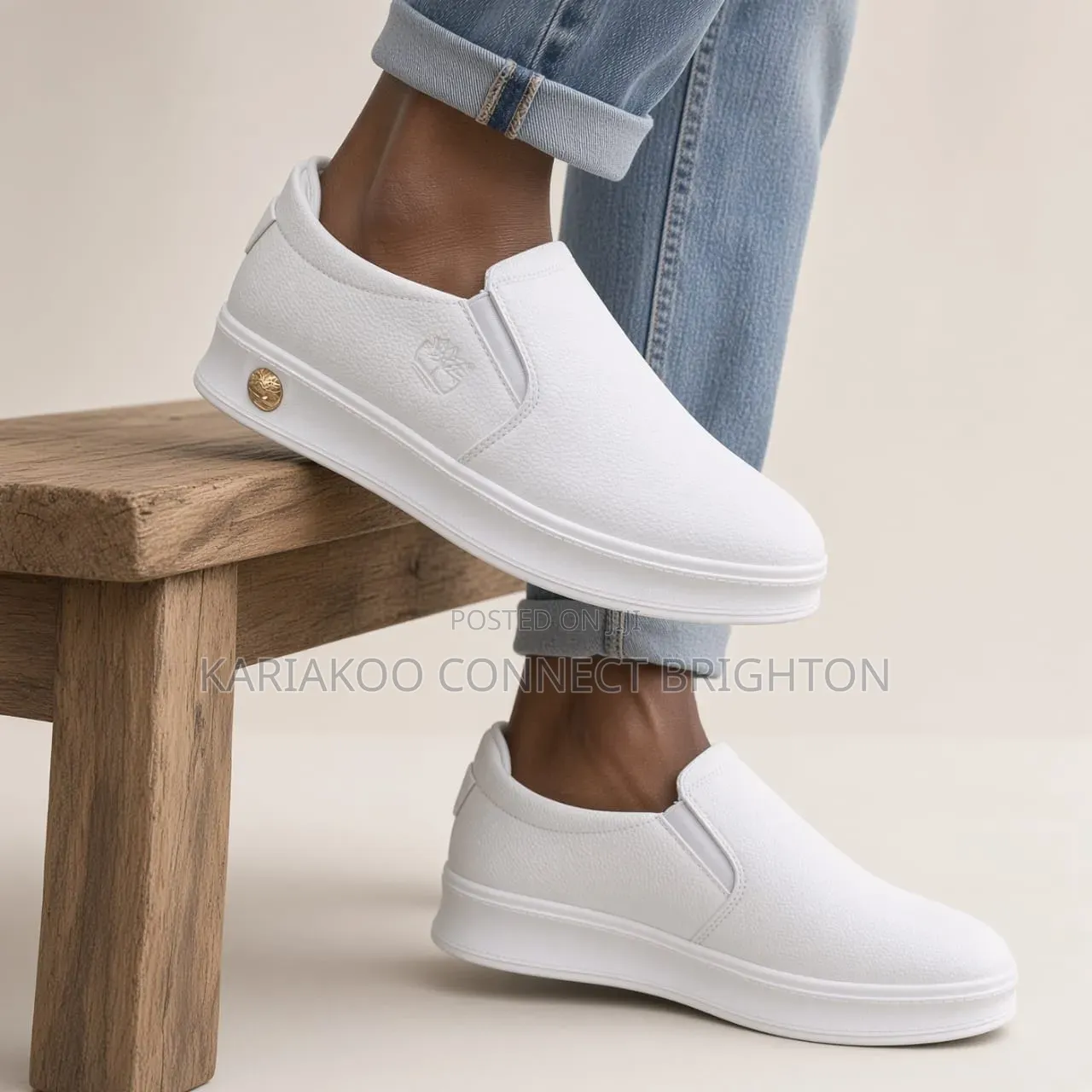 White Pebbled Leather Slip-on Casual Sneakers With Embossed Logo