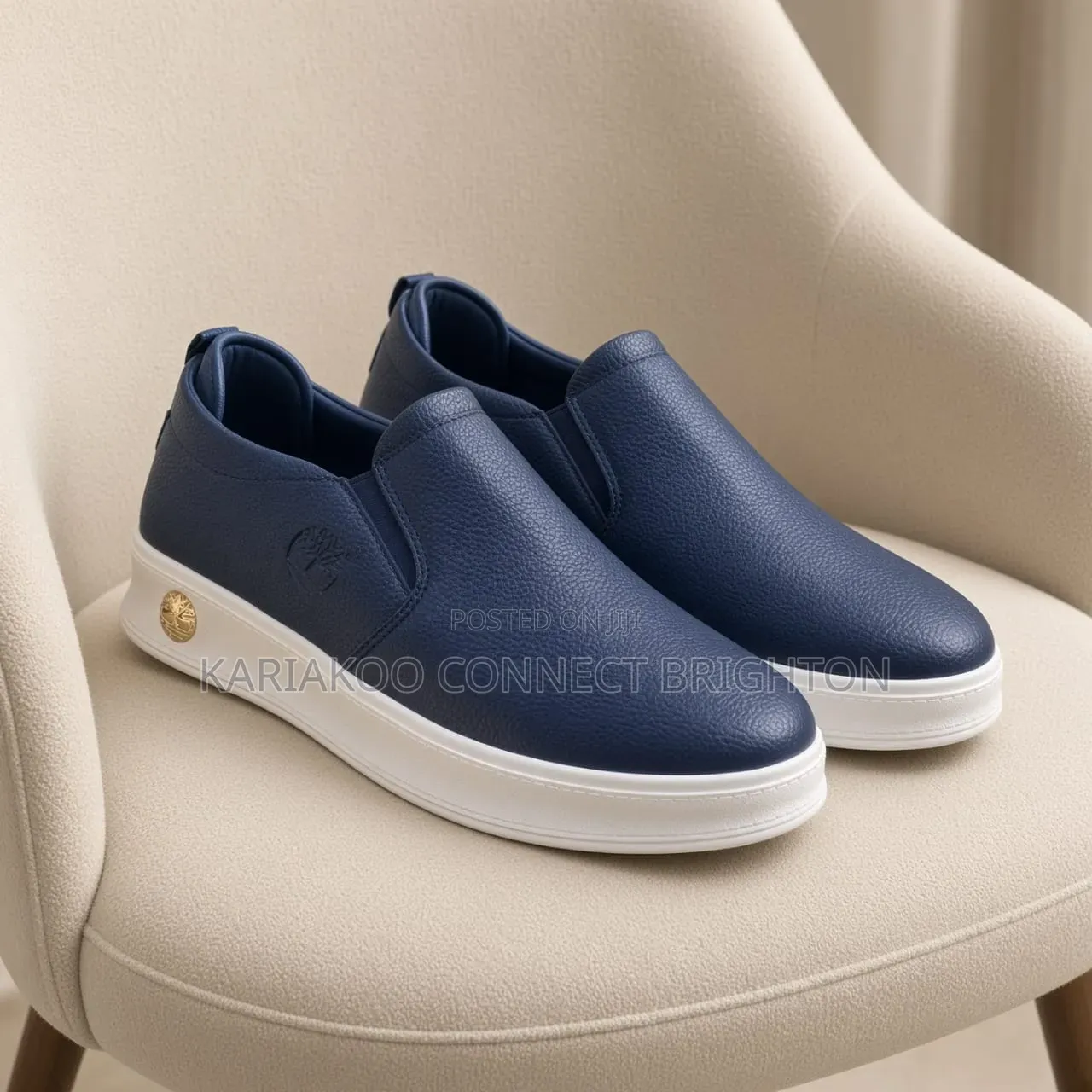 White Pebbled Leather Slip-on Casual Sneakers With Embossed Logo