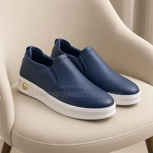 White Pebbled Leather Slip-on Casual Sneakers With Embossed Logo