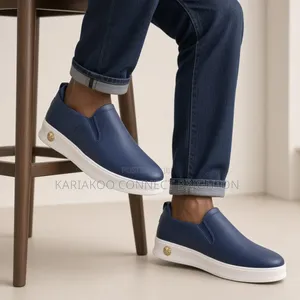 White Pebbled Leather Slip-on Casual Sneakers With Embossed Logo