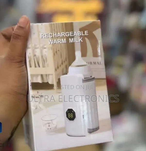 Portable Baby Milk Bottle Warmer With a Digital Temperature Display.