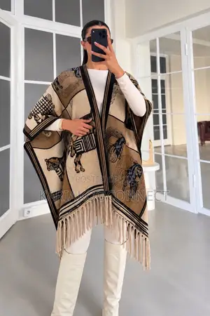 Fringed Poncho With Patterned Trim