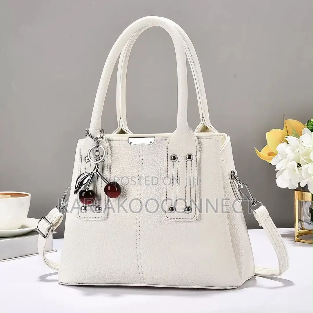 Elegant Handbag With Cherry Charm and Shoulder Strap