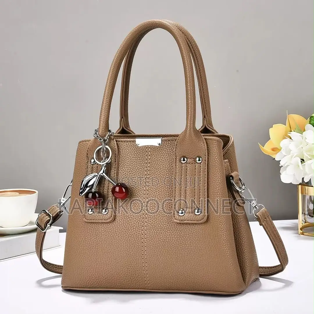 Elegant Handbag With Cherry Charm and Shoulder Strap