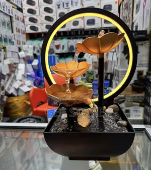 A 3-Tier Lotus Tabletop Water Fountain With a Warm LED Backlit Ring