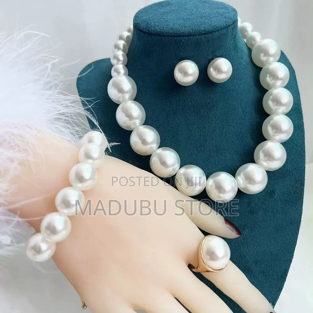 Set of Pearl Necklace, Earrings and Bracelet