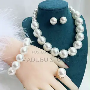 Set of Pearl Necklace, Earrings and Bracelet