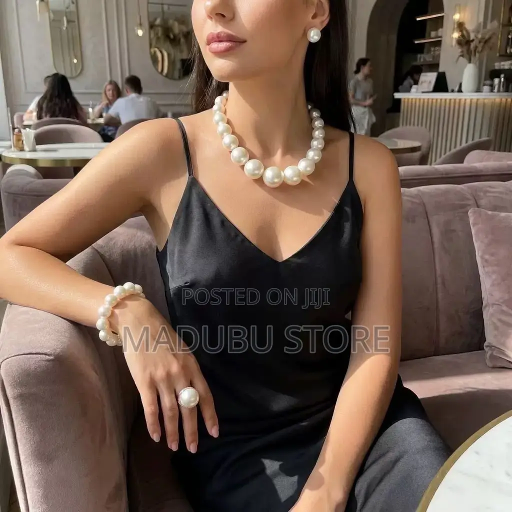 Set of Pearl Necklace, Earrings and Bracelet
