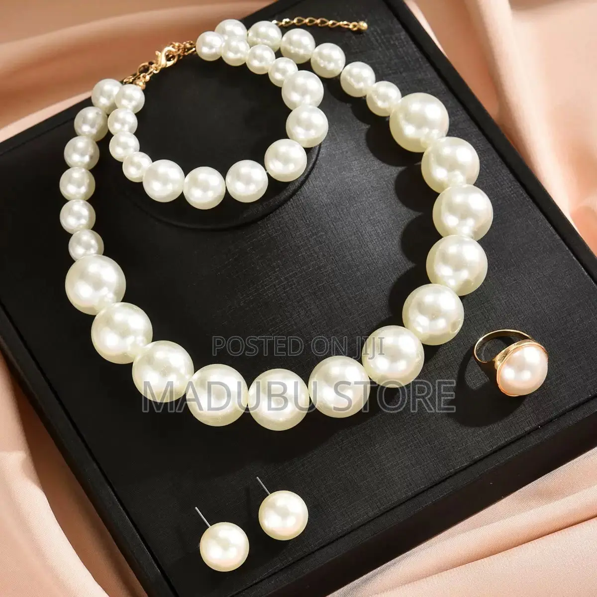 Set of Pearl Necklace, Earrings and Bracelet