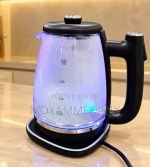 Glass Electric Kettlewith a Black Plastic Handle, a Black Lid,