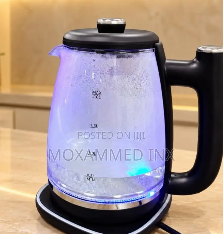 Glass Electric Kettlewith a Black Plastic Handle, a Black Lid,
