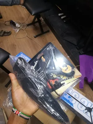 Full Set Mic Stand, Capo, Belt Guitar and Cable Guitar 110,000