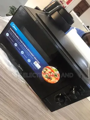Ofa Ofa Microwave Oven MIDEA 20L INAPASHA Inatumia Umeme