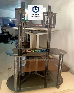 Television Table Made Up of Black Glass Tops and Tv Bracket