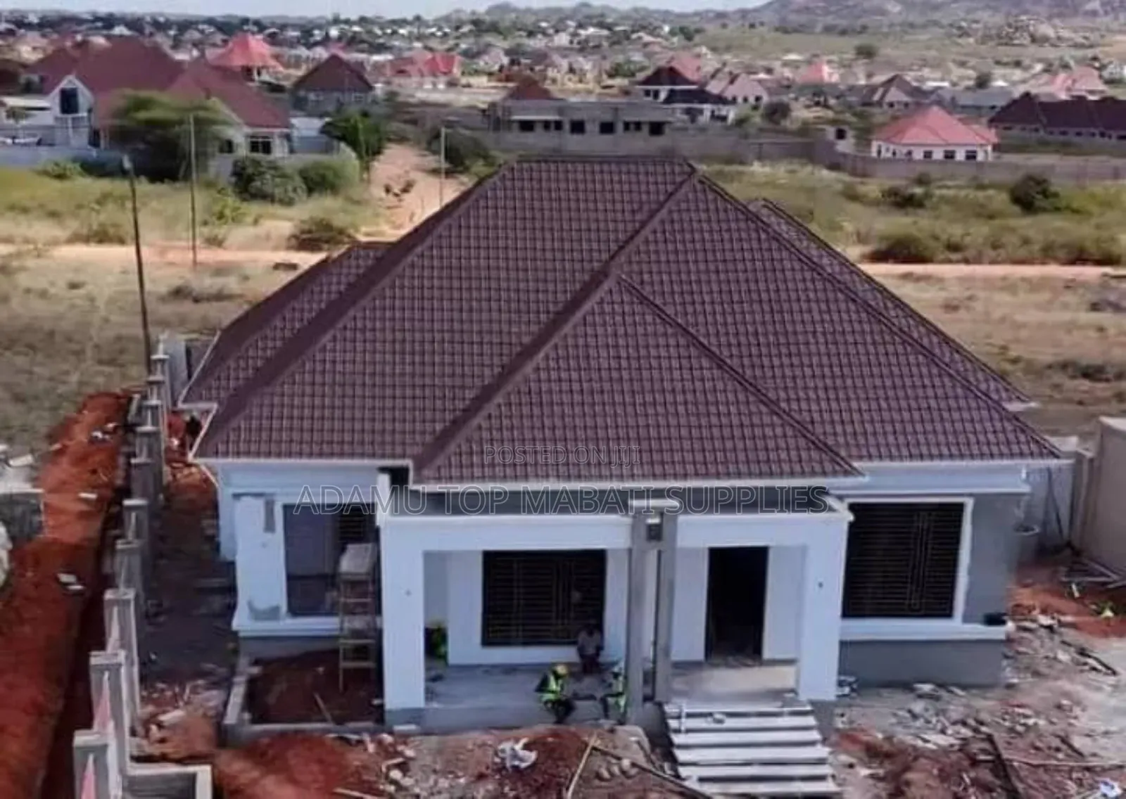 The House With a Roma Roofing Sheets