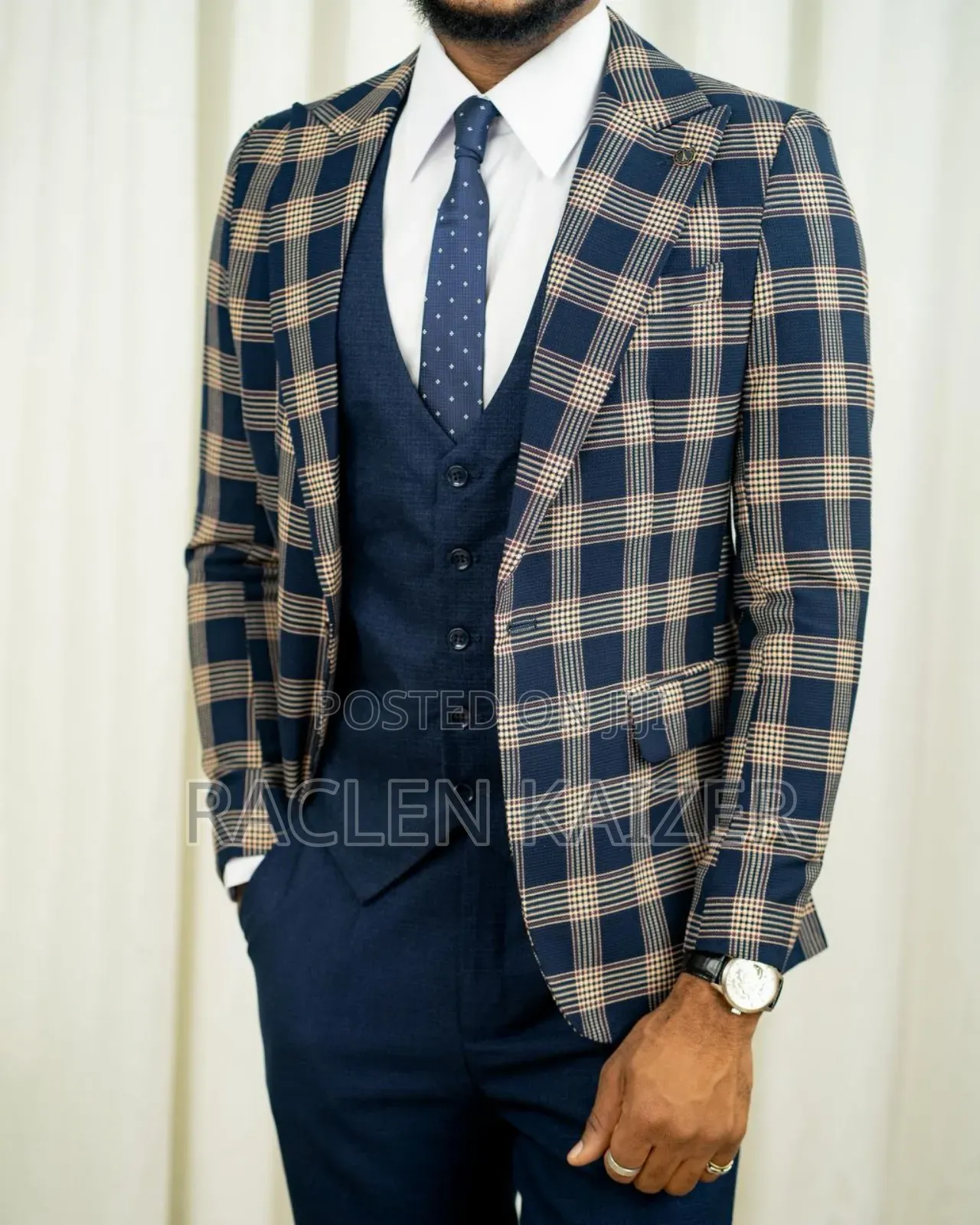 A Navy Suit With Beige Checkered Jacket, Vest, and Navy Trousers