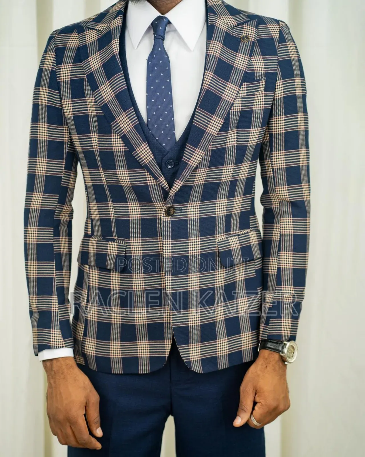 A Navy Suit With Beige Checkered Jacket, Vest, and Navy Trousers