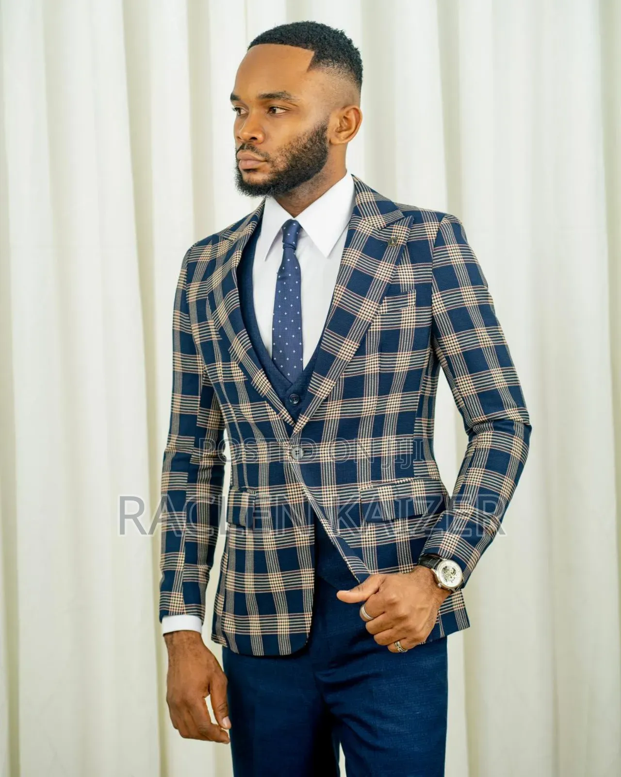 A Navy Suit With Beige Checkered Jacket, Vest, and Navy Trousers