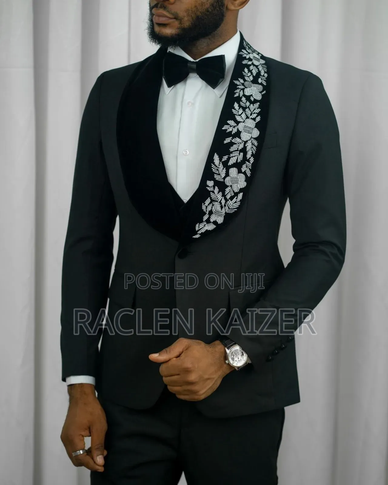 A Black Jacket Suits With Velvet Lapels Adorned With White Embroidery