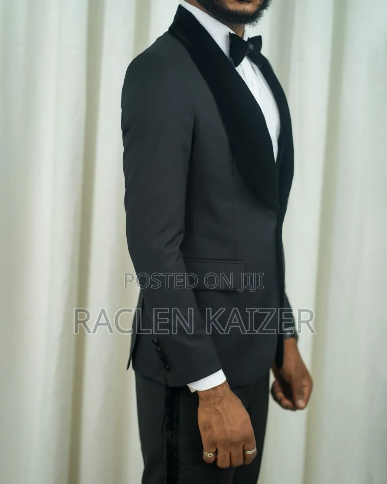 A Black Jacket Suits With Velvet Lapels Adorned With White Embroidery