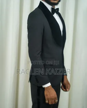 A Black Jacket Suits With Velvet Lapels Adorned With White Embroidery