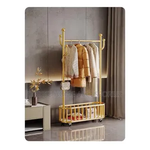 Golden Clothes Rack With a Hanging Rail, Hooks, and a Bottom Storage