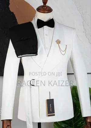 A White Suits Features a Distinctive Belt Detail at the Waist
