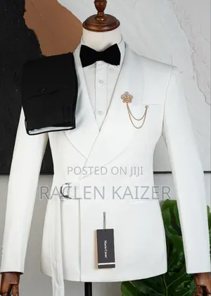 A White Suits Features a Distinctive Belt Detail at the Waist