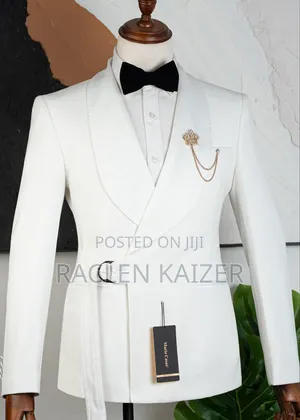 A White Suits Features a Distinctive Belt Detail at the Waist