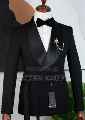 A Black Suits Features a Distinctive Belt Detail at the Waist