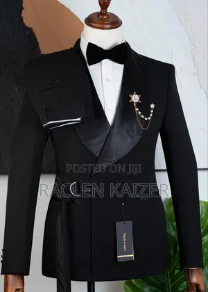 A Black Suits Features a Distinctive Belt Detail at the Waist