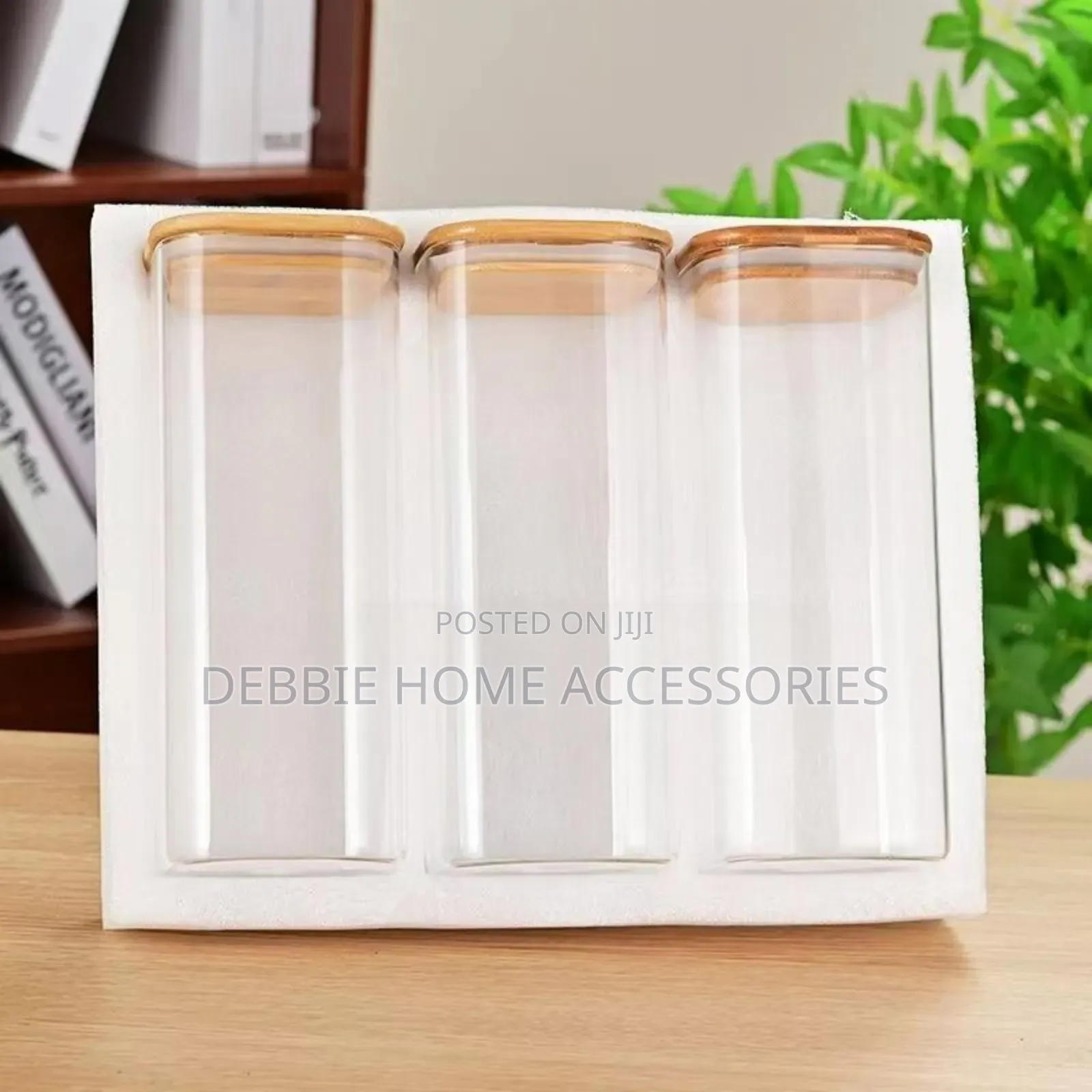Three Glass Storage Jars With Bamboo Lids.