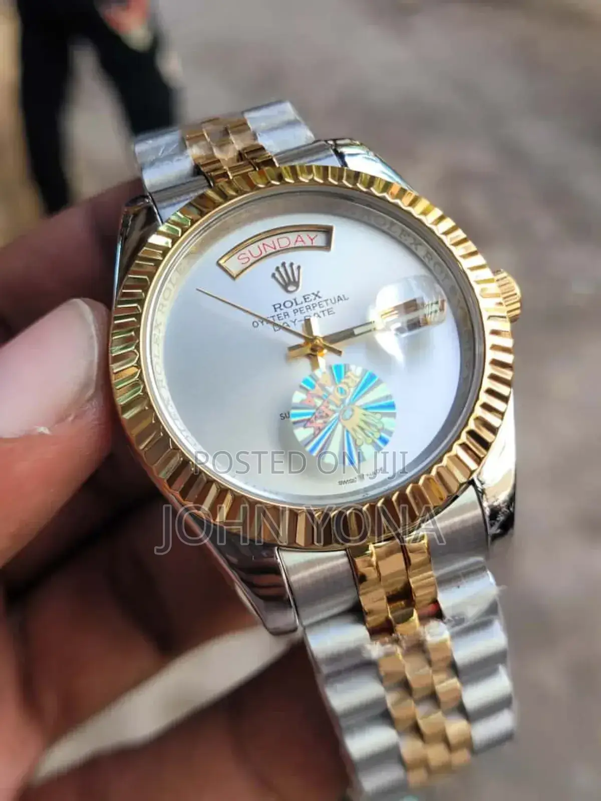 Rolex Day-Date Watch With a Two-Tone Metal Band and a White Face