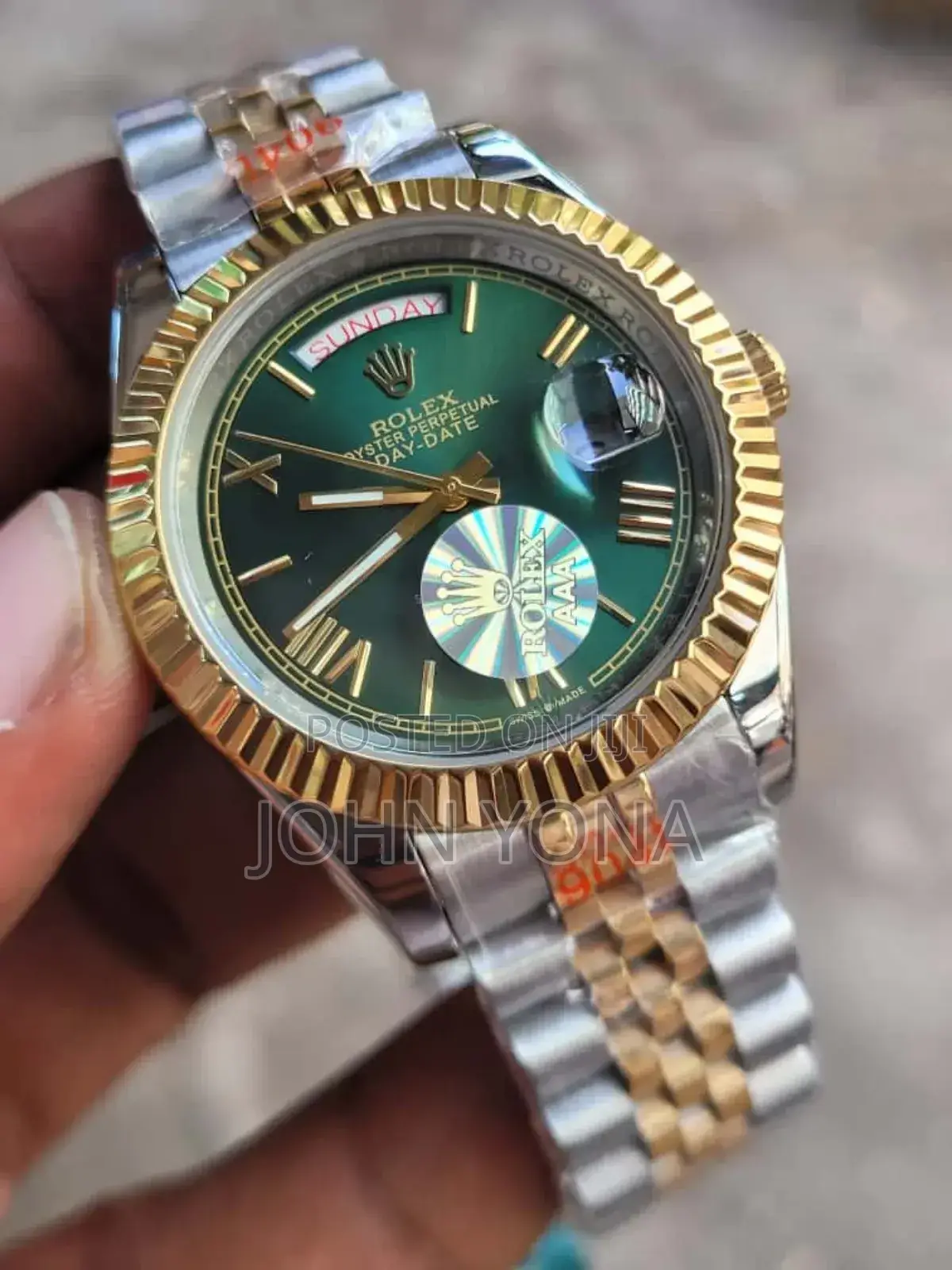 Rolex Day-Date Watch With a Green Dial and a Two-Tone Metal Bracelet.