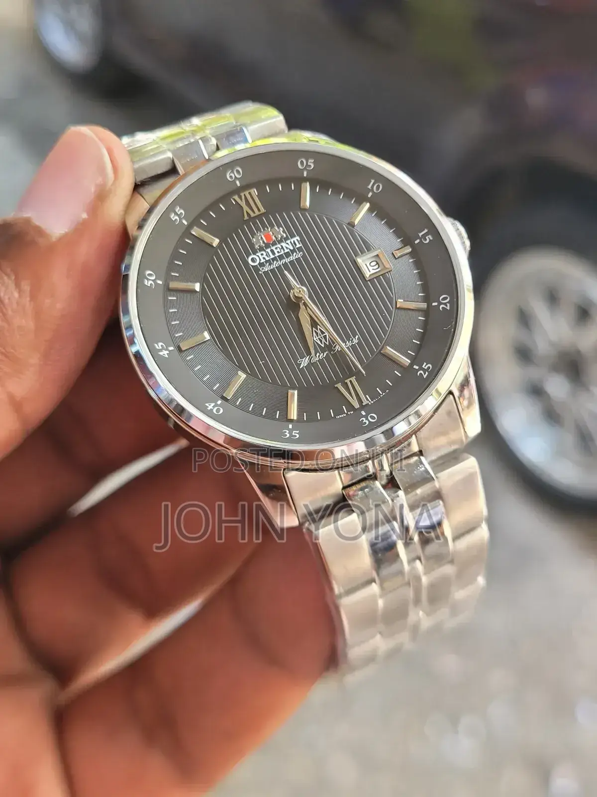 Orient Agent Automatic Watch With a Silver and Black Pin-Striped Dial