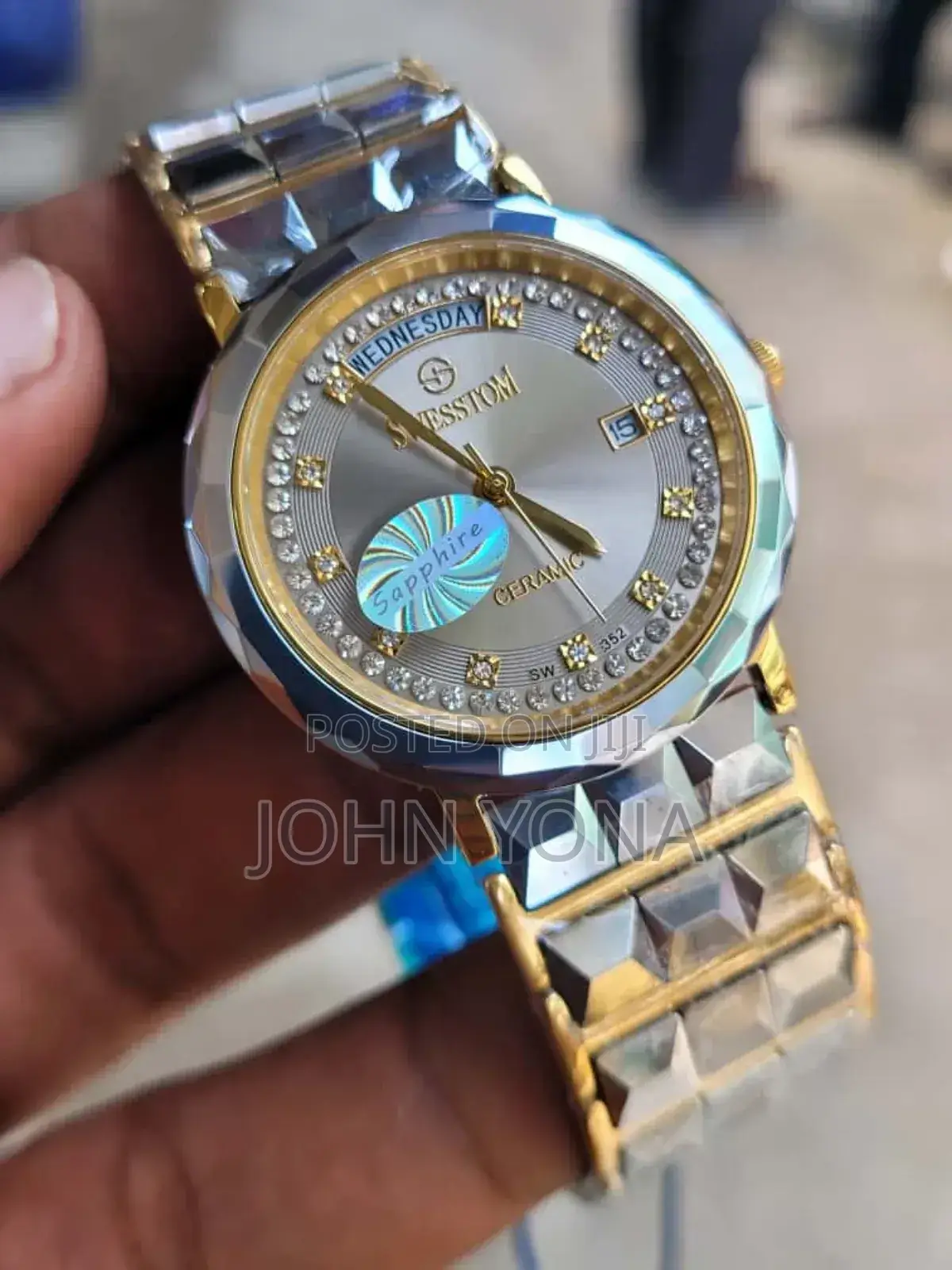 Sesstom Wristwatch With a Gold-and-Silver-Toned Band