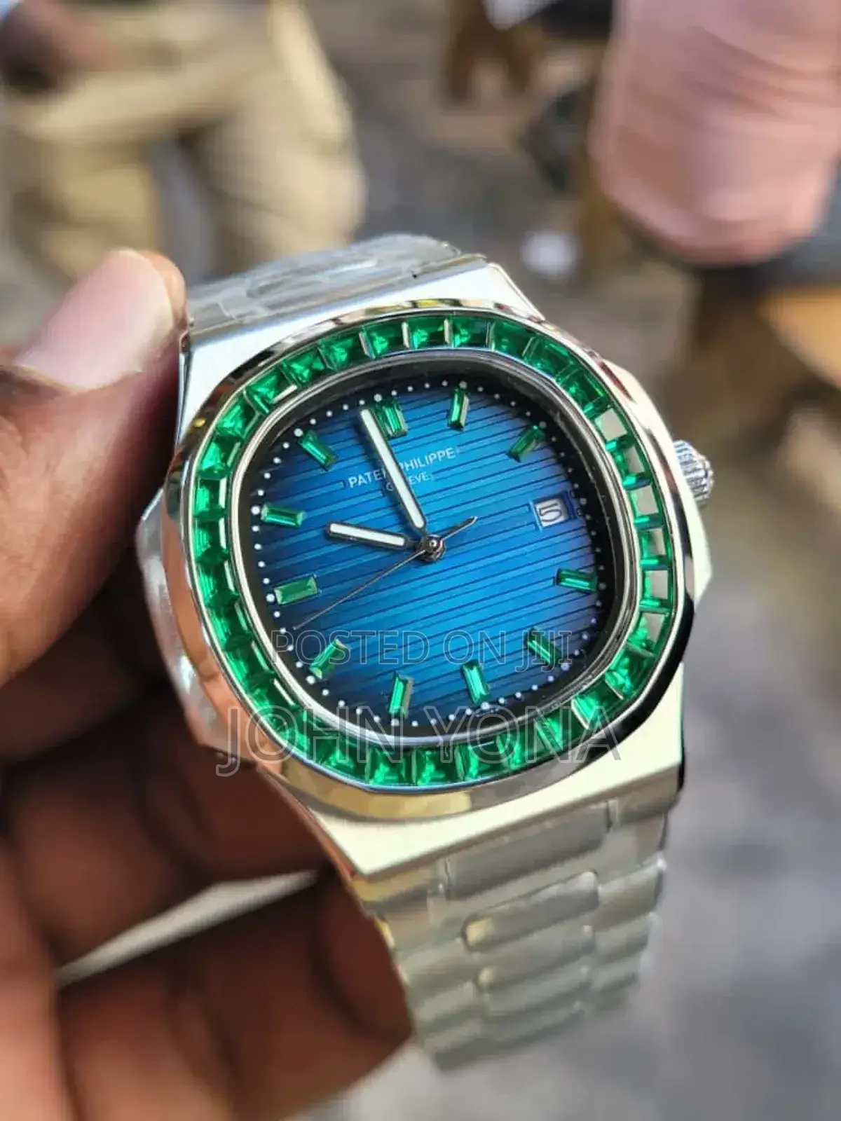 Patek Philippe Nautilus Watch With a Custom Bezel Set Green Emeralds