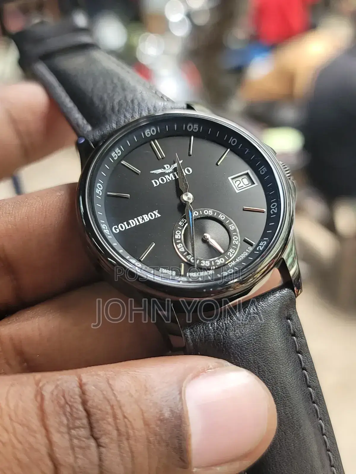 Domino Men's Watch With a Black Dial and a Black Leather Band.