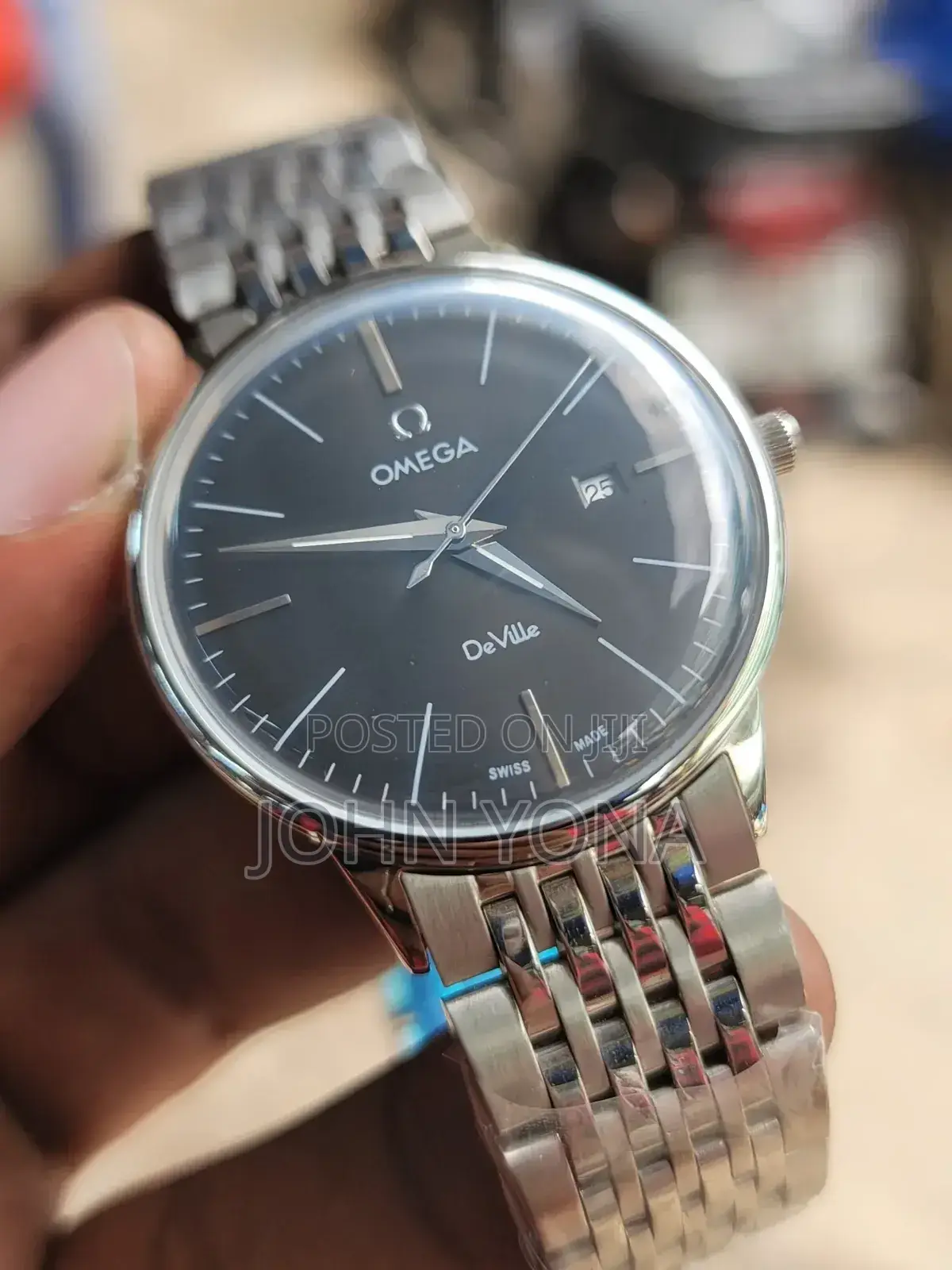 Omega De Ville Watch With a Black Dial and Silver Band